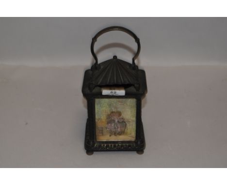 An early 20th century lantern having red glass,pictorial and porcelain inserts.
candle to illuminate internally, red glass pa