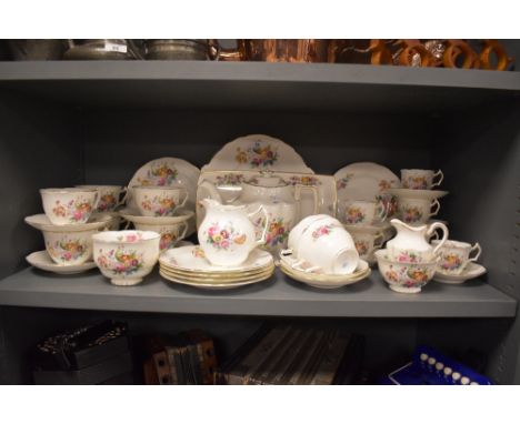 A Coalport 'Junetime' part tea service,having floral transfer pattern to include plates,teapot,cups and saucers etc.