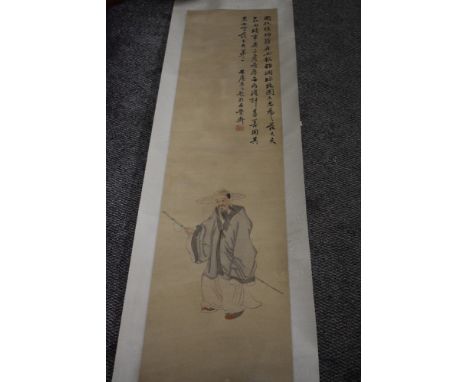 A Chinese paper scroll having painting of gent in traditional dress and symbols.