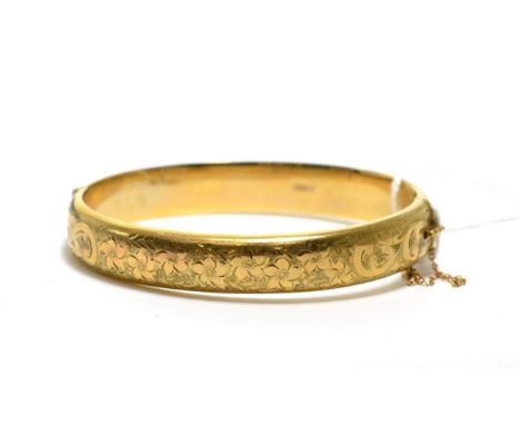 A 9ct gold bangle 14.21g