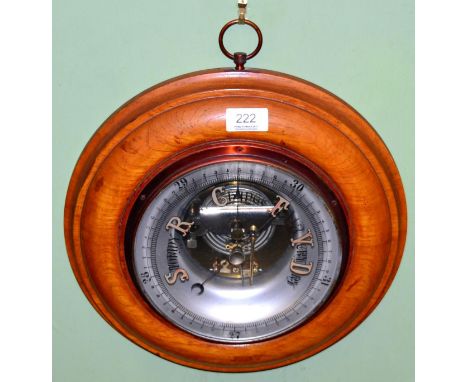 An oak cased aneroid barometer 