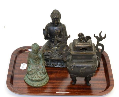Chinese bronze figure of a seated Buddha, Qing Dynasty; another smaller example; and a Chinese bronze censer and cover on fou