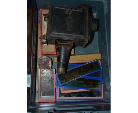 Magic lantern and slides with simple tin lantern with plaque to side 'Mawson, Swan & Morgan' with various rectangular glass s