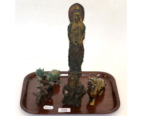 An early small Chinese model of a water buffalo and rider; two bronze mythical animals; a small figure of Shoulao; and a Chin