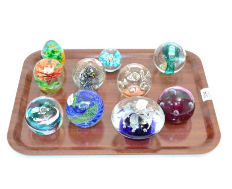 Ten various glass paperweights including Caithness examples