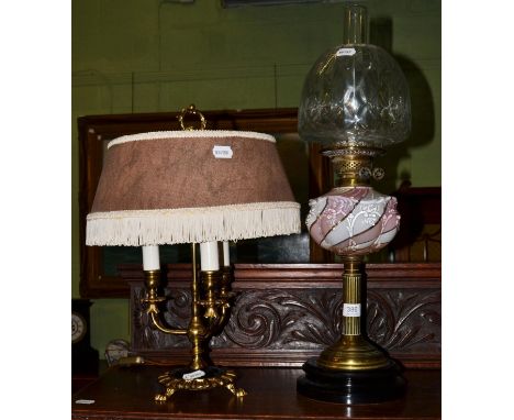 A brass columnar oil lamp with a pink and white glass reservoir together with a 19th century style table lamp (2) 