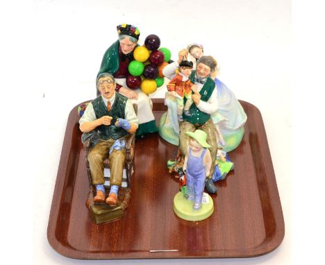 A group of five Royal Doulton figures: Golliwog HN 20407, The Puppet maker HN 2253, The Batchelor HN 2319, The Old Balloon Se