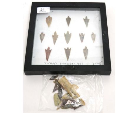 A collection of African Neolithic carved stone arrowheads and tools, circa 2000-3000 BCE , to include a framed set of knapped