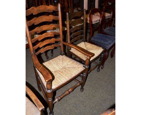 Two Lancashire ladder back chairs, together with a set of three Victorian balloon back dining chairs 