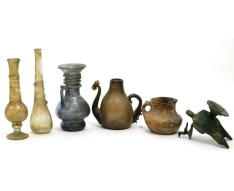 An ancient jug with single handle,  possibly Cypriot or Central Asian, remains of enamelled decoration, 9cm wide, with three 