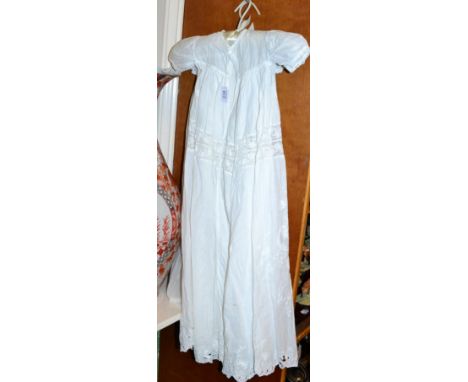 Late 19th century white cotton Christening gown, with short sleeves, lace insertions, stylised floral designs to the front sk