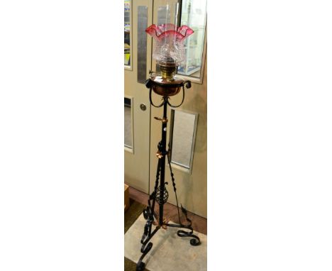 An Arts & Crafts wrought iron and copper standard lamp 