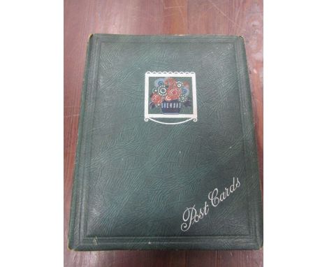 An album of vintage greeting cards and postcards