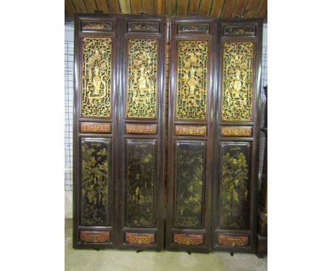 19th Century Chinese lacquered&nbsp;hardwood four fold screen with open recesses carved and gilt fretwork over ebonised&nbsp;
