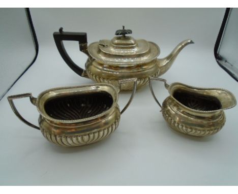 A silver hallmarked tea set - Sheffield 1919 by Cooper Brothers and Son. With a Bakelite handle and finial lid top (slight ch