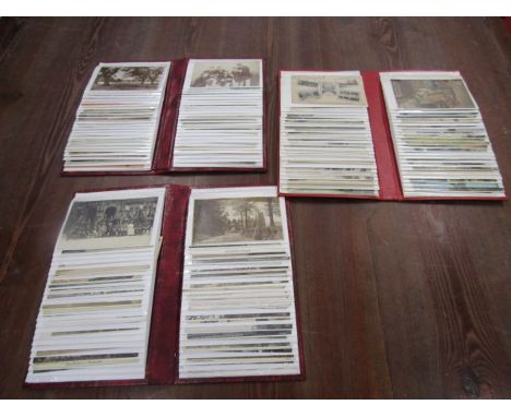 3 albums containing vintage postcards, not all photographed