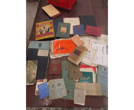 a red box of ephemera to include vintage singer sewing booklets, leaflets, maps, identity cards etc etc
