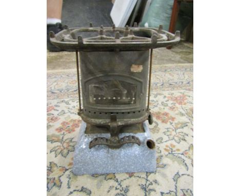 A vintage greenhouse heater
