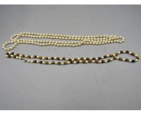 2 sets of genuine pearl necklaces, one with tigers eye