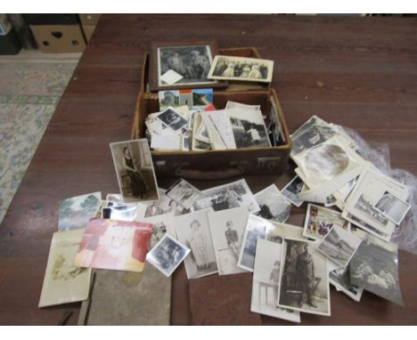 A small case containing vintage photographs