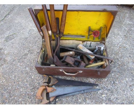 A wooden chest with vintage hand tools