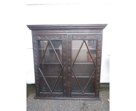 A vintage oak glazed cupboard 107cmW 110cmH 31cmDwas part of a marriage