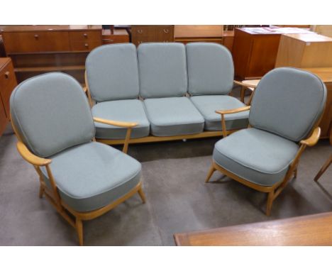 An Ercol Blonde beech Windsor settee and a pair of armchairs, with new replacement sage wool fabric cushions