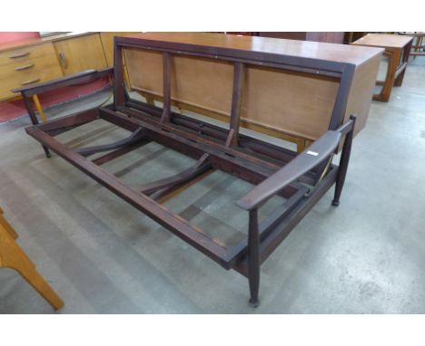 A Guy Rogers teak Manhattan sofa bed, designed by George Fejer and Eric Phamphilon 