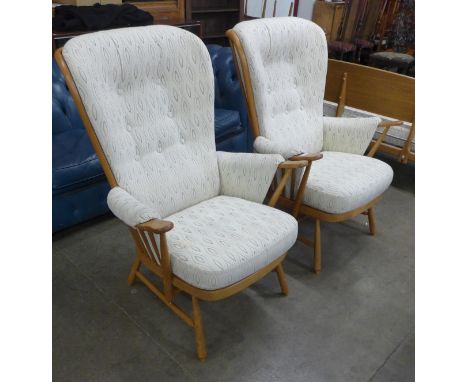 A pair of Ercol Blonde beech Evergreen armchairs 