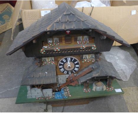 A Swiss painted wooden cuckoo clock 