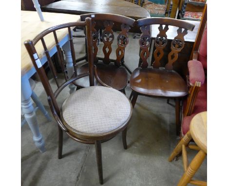 A beech bentwood chair and two Ercol beech fleur de lys chairs 