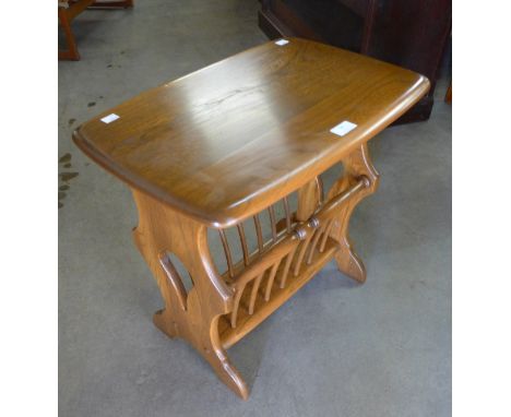 An Ercol Golden Dawn ash magazine rack 