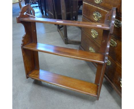 A Victorian walnut wall hanging book shelf 