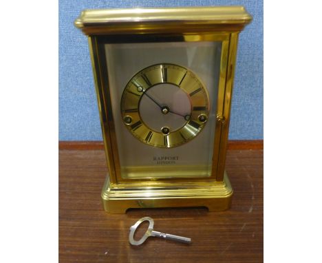 A Rapport of London brass and four sided glass mantel clock 