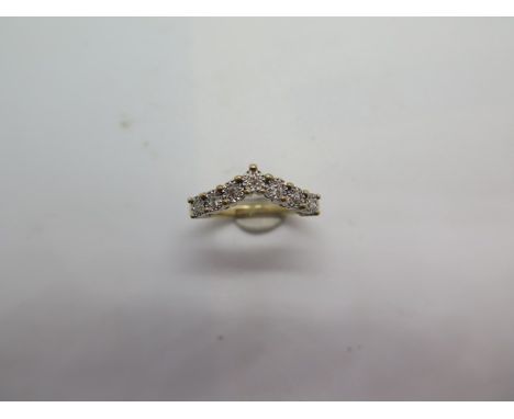 A hallmarked 9ct yellow gold diamond wishbone ring, size K, approx total ct 0.10 and approx 2.6 grams, in good condition 