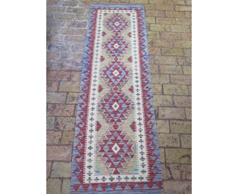 A new hand knotted woollen Chobi Kilim runner, 1.93m x 0.62m 