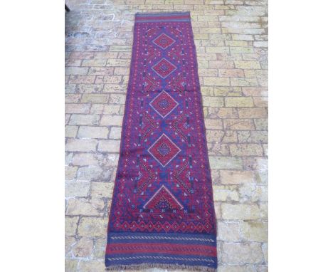 A new hand knotted woollen Meshwani runner, 2.47m x 0.6m 