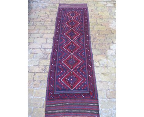 A new hand knotted woollen Meshwani runner, 2.3m x 0.66m 