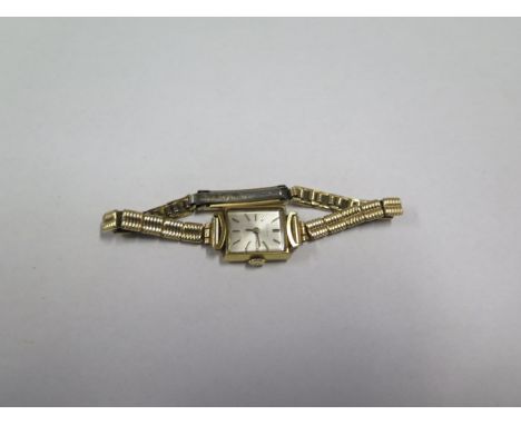 An 18ct yellow gold ladies manual wind wristwatch on a plated strap, not running, total weight approx 16 grams 