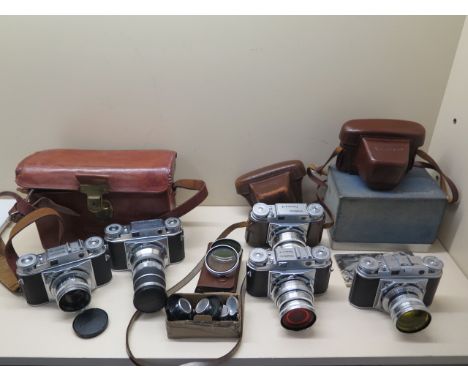 A collection of Voigtlander Prominent 35mm Rangefinder camera equipment, includes; 5 Prominent camera bodies, 35/50/50/100 an