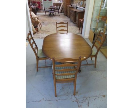 An Ercol elm oval extending dining table and 4 chairs with seat pads, 74cm tall x 166cm x 114cm extended, closes to 114cm, ge