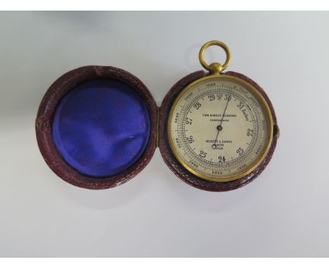 A Negretti and Zambra compensated pocket barometer, no 18926, 5cm diameter with outer case, in working order and dial good 