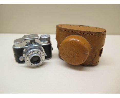 A miniature Japanese shutter camera in case, 5cm wide, working 