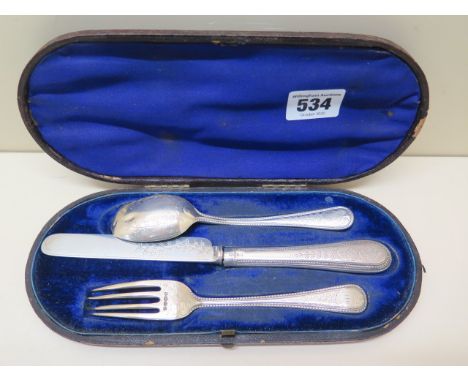A silver three piece christening set, hallmarked London 1914/15, indistinct makers mark, foliate engraved and detailed 'From 