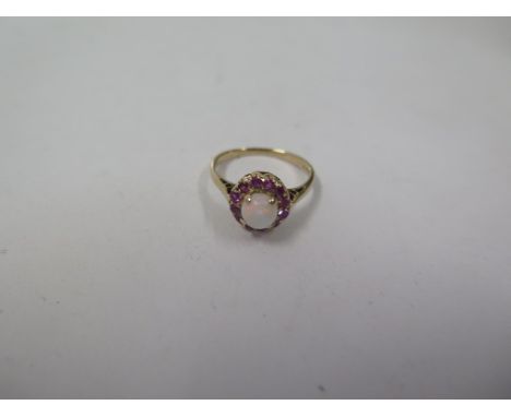 A 9ct yellow gold, opal and ruby ring, marked 9ct, size K, approx 2.2 grams, in good condition 