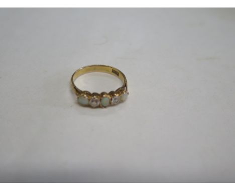 A 20ct gold opal and white stone ring, ring size K, approx 2 grams, marked 20K, some minor usage 