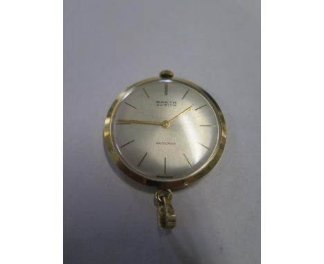 An 18ct yellow gold Barth of Zurich antichoc lapel watch, manual wind, 34mm wide, hands advance and running in saleroom, tota