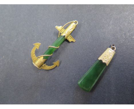 A yellow metal mounted jade pendant and a yellow metal mounted jade anchor, 5cm long, total weight 10 grams 