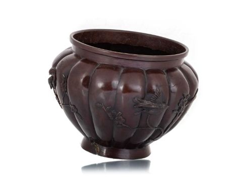JAPANESE BRONZED SPELTER PLANTER, MEEIJI PERIOD (1868 - 1912) of lobed form, decorated in relief with birds in flight amongst