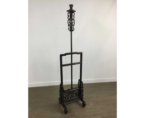 CHINESE HARDWOOD FLOOR LAMP, LATE 19TH / EARLY 20TH CENTURY with pierced scrolling decoration, raised on four feet, with shad